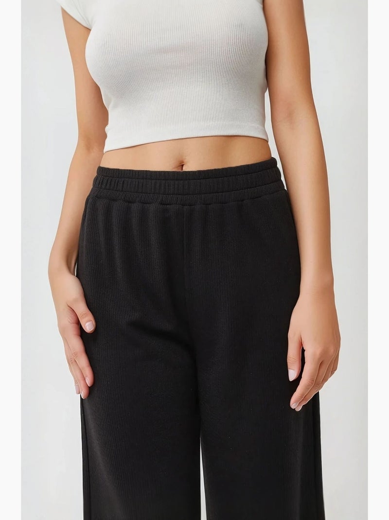 Pantaloni a gamba larga in maglia con elastico in vita hiccup Nero - Kiabi
