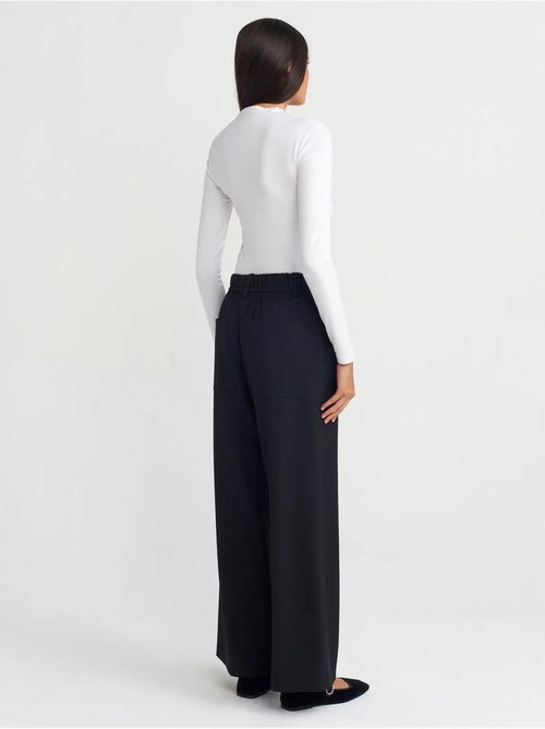 Pantaloni a gamba larga in tessuto con vita elasticizzata e coulisse - Kiabi Pantaloni a gamba larga in tessuto con vita elasticizzata e coulisse - Kiabi