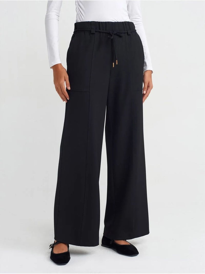 Pantaloni a gamba larga in tessuto con vita elasticizzata e coulisse Nero - Kiabi