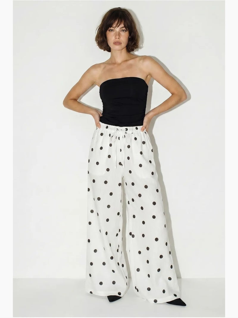 Pantaloni a pois a gamba ampia con cintura da annodare in vita lucci Bianco sporco - Kiabi