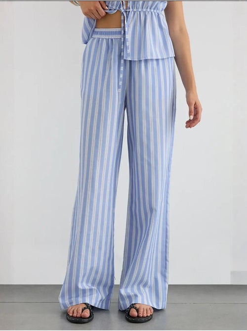 Pantaloni a righe a gamba larga con elastico in vita hiccup - Kiabi Pantaloni a righe a gamba larga con elastico in vita hiccup - Kiabi