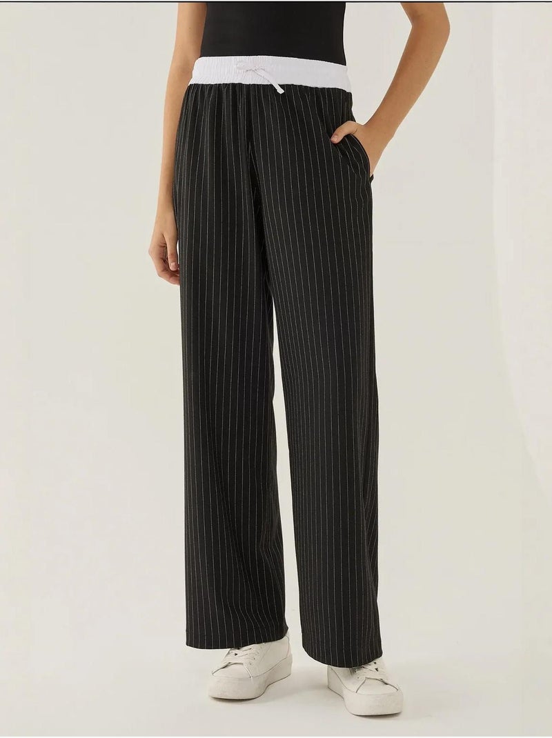 Pantaloni a righe con elastico in vita Nero - Kiabi