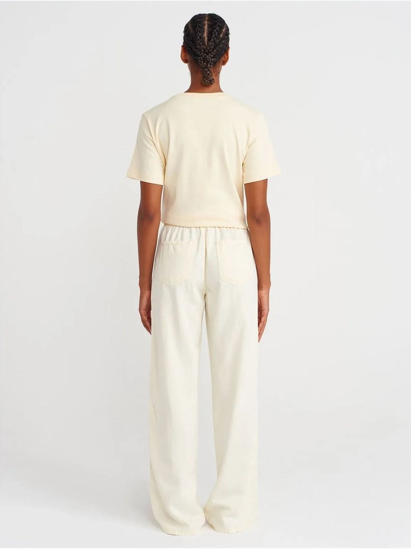 Pantaloni a vita alta a gamba ampia con cintura da annodare dilvin Crema - Kiabi