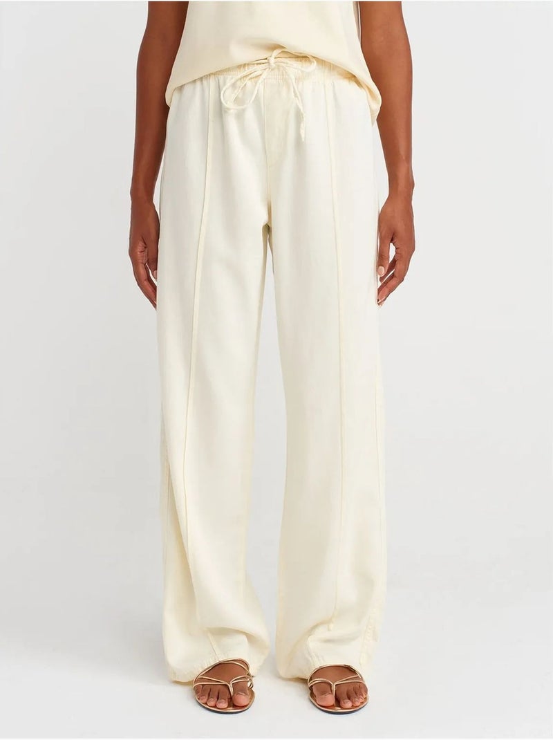 Pantaloni a vita alta a gamba ampia con cintura da annodare dilvin Crema - Kiabi