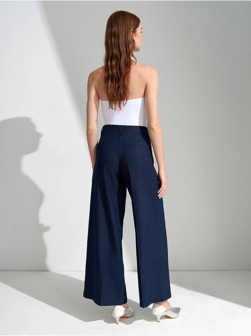 Pantaloni a vita alta a gamba ampia con pieghe dilvin Blu marino - Kiabi