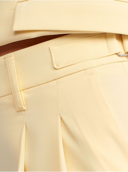 Pantaloni a vita alta a gamba ampia con pieghe dilvin - Kiabi Pantaloni a vita alta a gamba ampia con pieghe dilvin - Kiabi