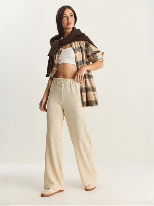 Pantaloni a vita alta a gamba ampia lucci - Kiabi Pantaloni a vita alta a gamba ampia lucci - Kiabi