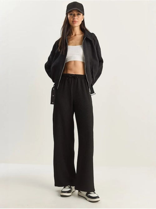 Pantaloni a vita alta a gamba ampia lucci - Kiabi Pantaloni a vita alta a gamba ampia lucci - Kiabi