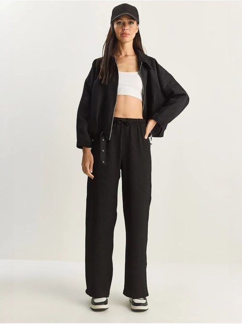Pantaloni a vita alta a gamba ampia lucci - Kiabi Pantaloni a vita alta a gamba ampia lucci - Kiabi