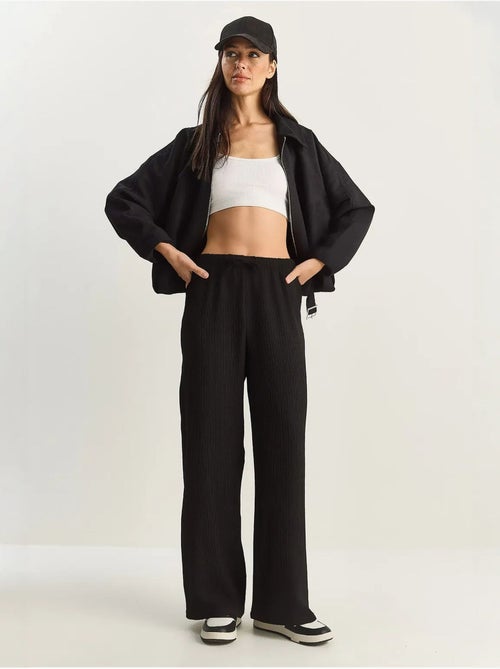 Pantaloni a vita alta a gamba ampia lucci - Kiabi Pantaloni a vita alta a gamba ampia lucci - Kiabi