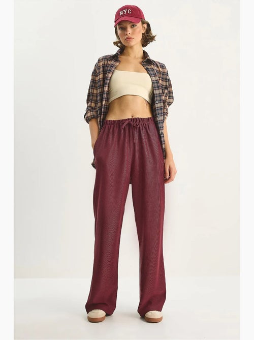 Pantaloni a vita alta a gamba ampia lucci - Kiabi Pantaloni a vita alta a gamba ampia lucci - Kiabi