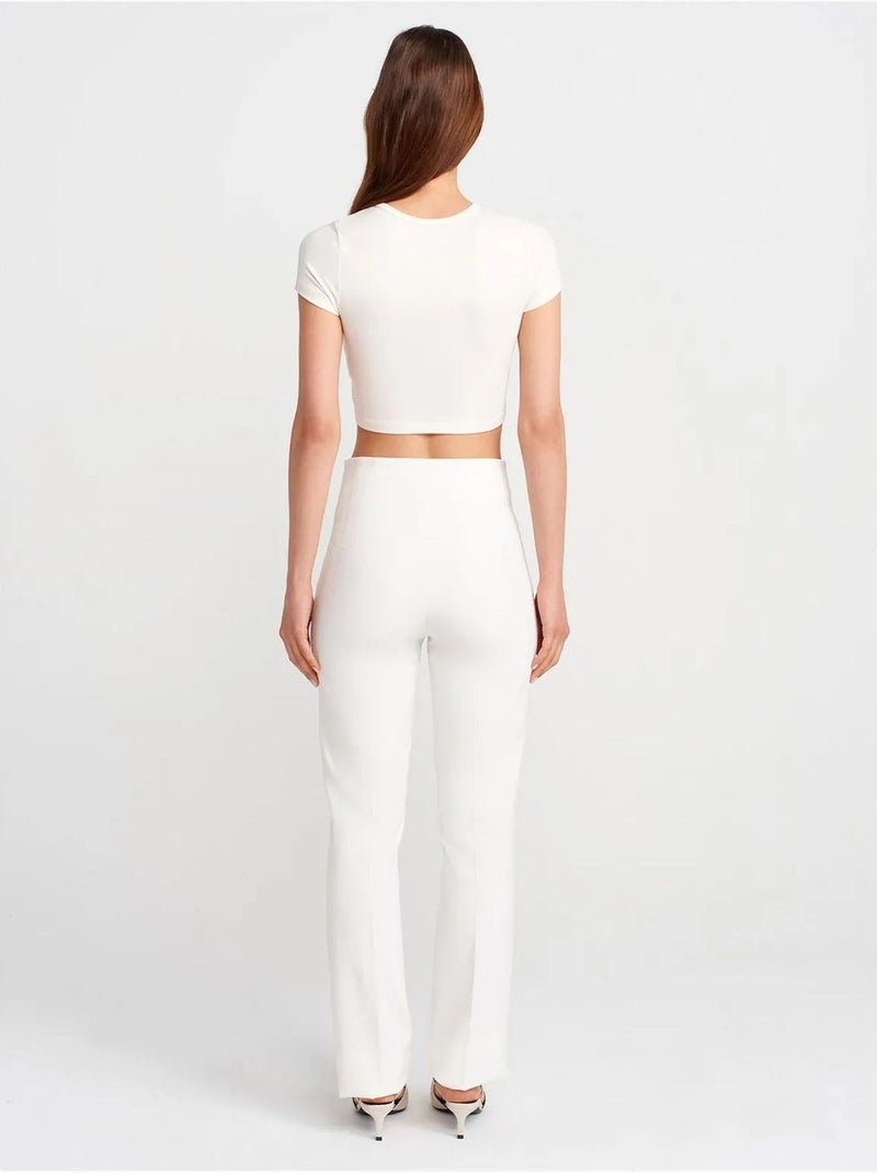 Pantaloni a vita alta a zampa con pieghe Bianco - Kiabi