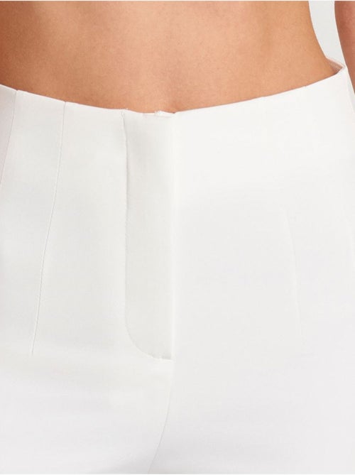 Pantaloni a vita alta a zampa con pieghe - Kiabi Pantaloni a vita alta a zampa con pieghe - Kiabi
