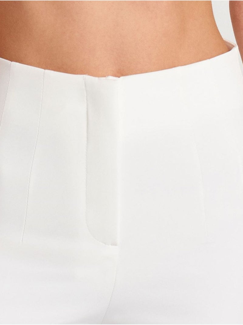 Pantaloni a vita alta a zampa con pieghe Bianco - Kiabi