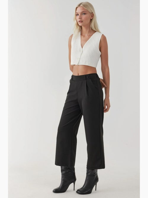 Pantaloni a vita alta con dettaglio bottoni hiccup - Kiabi Pantaloni a vita alta con dettaglio bottoni hiccup - Kiabi