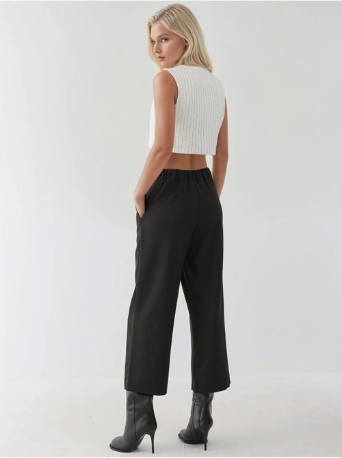 Pantaloni a vita alta con dettaglio bottoni - Kiabi Pantaloni a vita alta con dettaglio bottoni - Kiabi