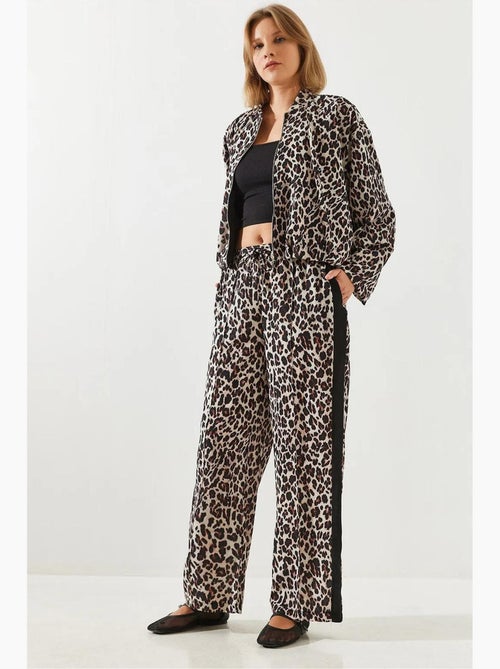 Pantaloni a vita alta con stampa leopardata a gamba ampia lucci - Kiabi Pantaloni a vita alta con stampa leopardata a gamba ampia lucci - Kiabi