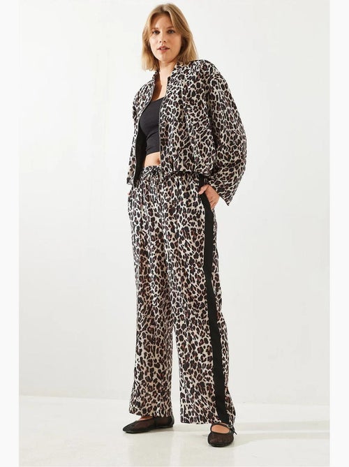 Pantaloni a vita alta con stampa leopardata a gamba ampia lucci - Kiabi Pantaloni a vita alta con stampa leopardata a gamba ampia lucci - Kiabi