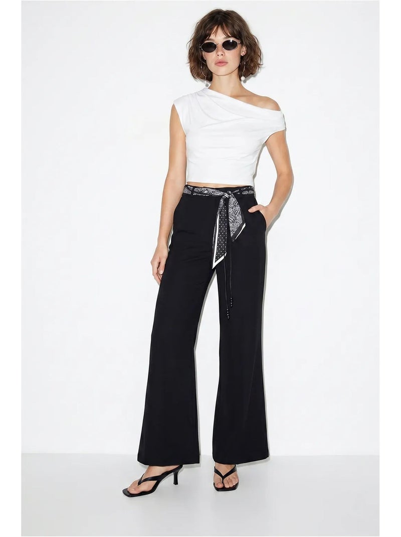 Pantaloni a zampa a vita alta con cintura lucci Nero - Kiabi