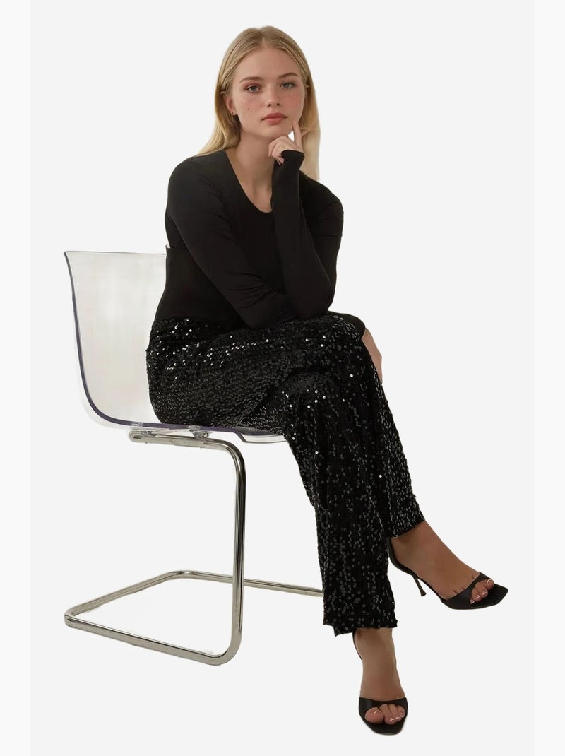 Pantaloni a zampa con paillettes hiccup Nero - Kiabi