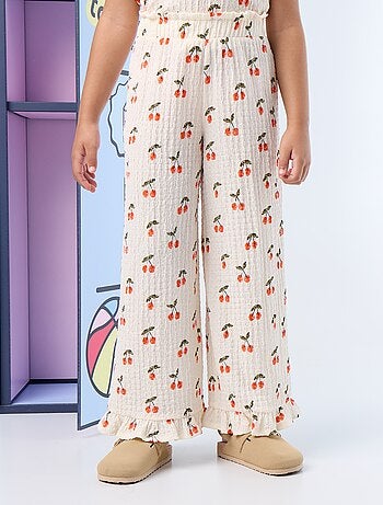 Pantaloni ampi con balze sul fondo