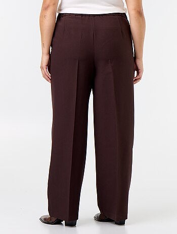Pantaloni ampi con bottoni dorati fantasia