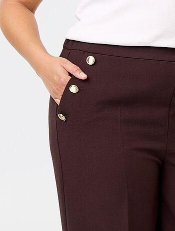 Pantaloni ampi con bottoni dorati fantasia