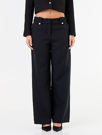 Pantaloni ampi con bottoni dorati