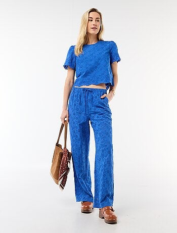 Pantaloni ampi con ricamo inglese in cotone tinta unita