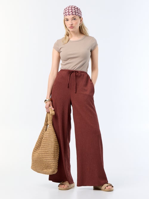 Pantaloni ampi crêpe con 2 tasche - Kiabi Pantaloni ampi crêpe con 2 tasche - Kiabi
