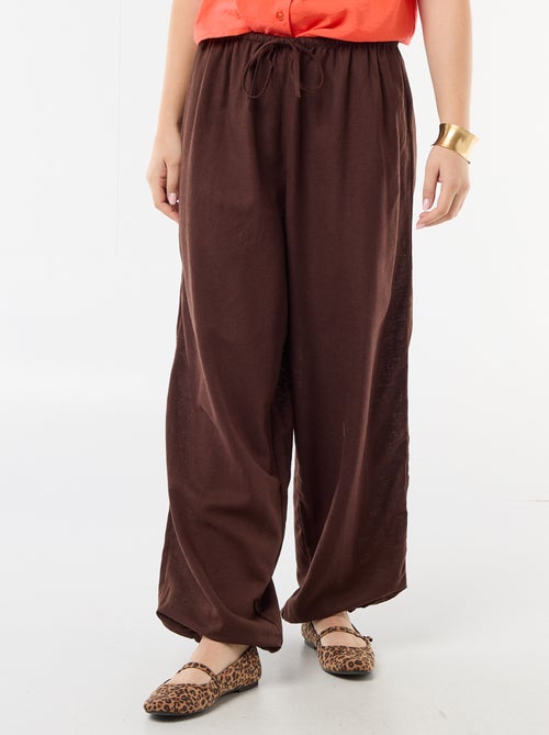 Pantaloni ampi da donna con vita elasticizzata e fondo elasticizzato - Kiabi Pantaloni ampi da donna con vita elasticizzata e fondo elasticizzato - Kiabi