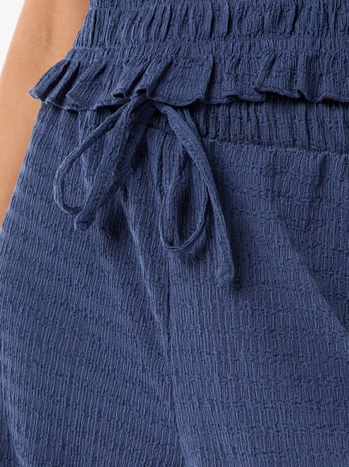 Pantaloni ampi in maglia smock - Kiabi