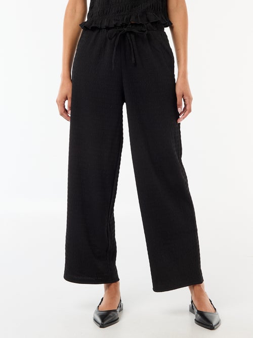 Pantaloni ampi in maglia smock - Kiabi