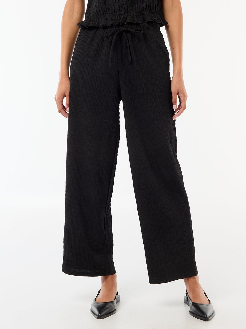 Pantaloni ampi in maglia smock Nero - Kiabi