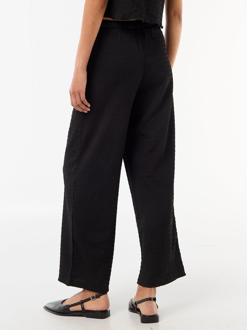 Pantaloni ampi in maglia smock Nero - Kiabi