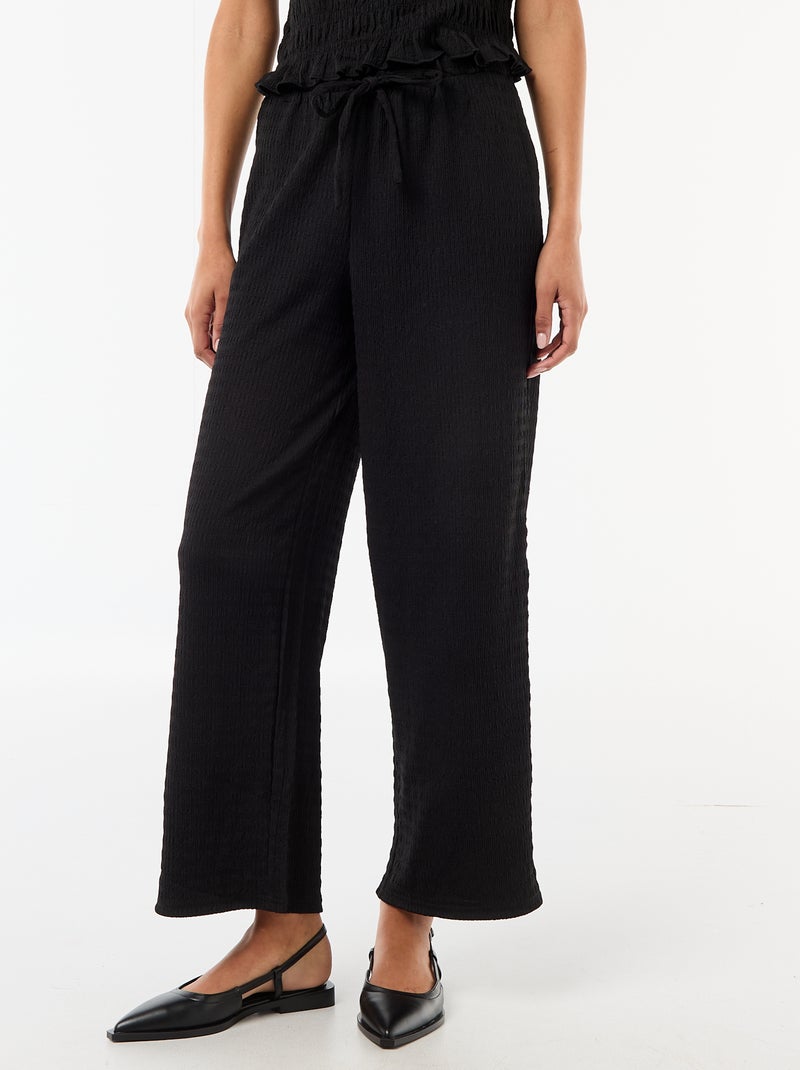 Pantaloni ampi in maglia smock Nero - Kiabi