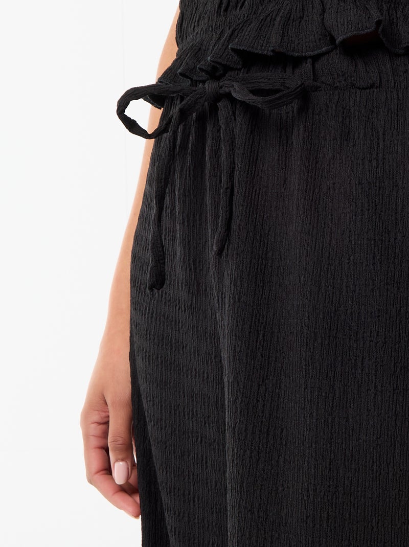 Pantaloni ampi in maglia smock Nero - Kiabi