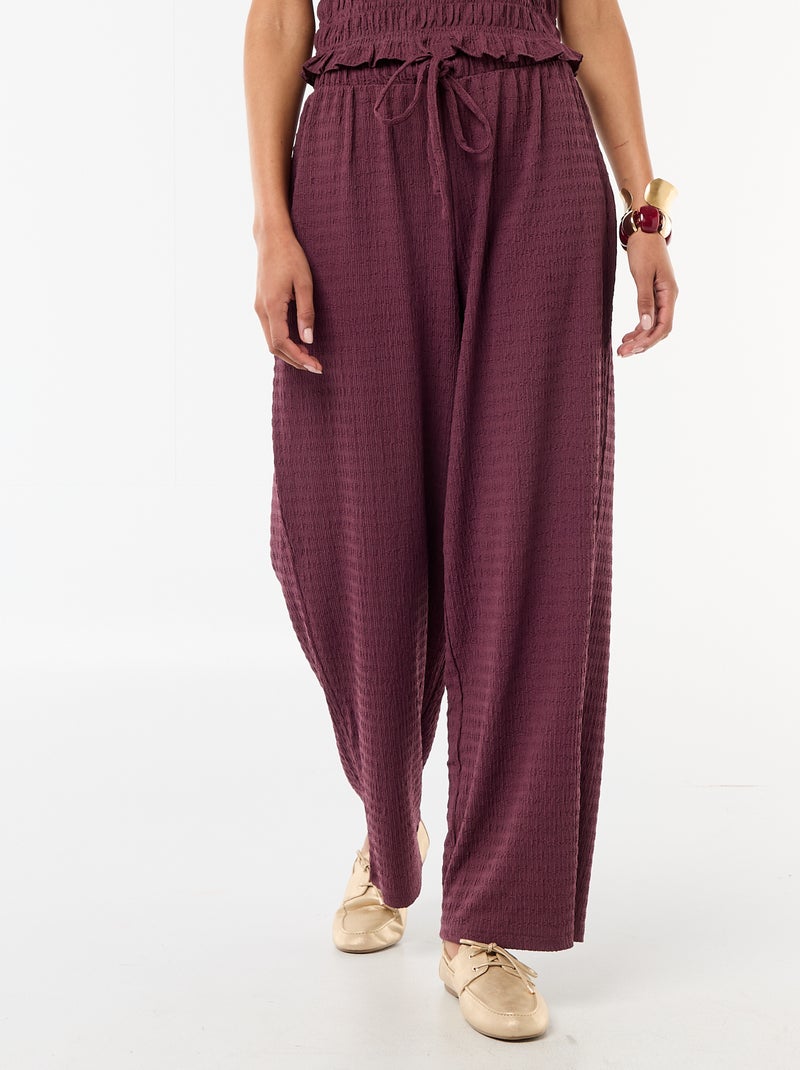 Pantaloni ampi in maglia smock Viola - Kiabi