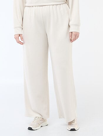 Pantaloni ampi in tessuto stretch a coste