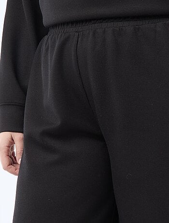 Pantaloni ampi in tessuto stretch a coste