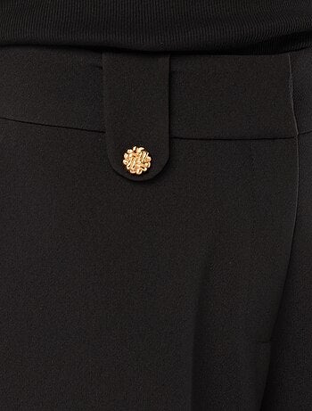 Pantaloni ampi tinta unita con apertura zip e gancio