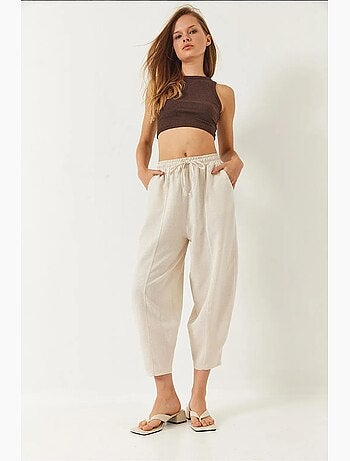 Pantaloni con elastico in vita e cavallo basso e dettaglio tasca lucci