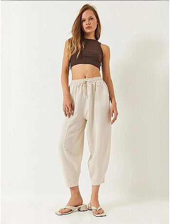 Pantaloni con elastico in vita e cavallo basso e dettaglio tasca lucci