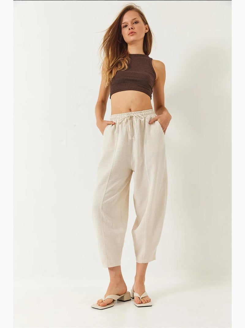 Pantaloni con elastico in vita e cavallo basso e dettaglio tasca lucci Beige argilla - Kiabi