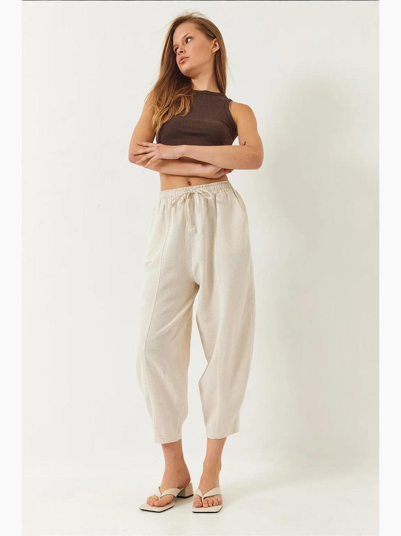 Pantaloni con elastico in vita e cavallo basso e dettaglio tasca lucci Beige argilla - Kiabi