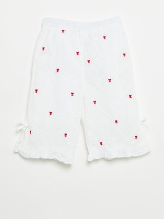 Pantaloni con fiocchi decorativi e ricami sangallo