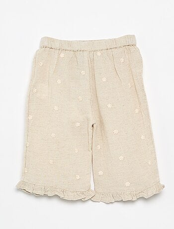 Pantaloni con ricami floreali
