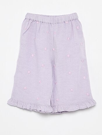 Pantaloni con ricami floreali