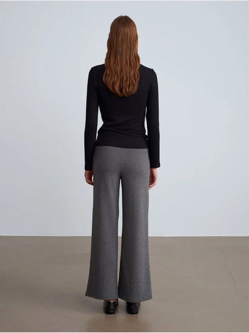 Pantaloni da donna in tessuto a gamba ampia a vita media - Kiabi