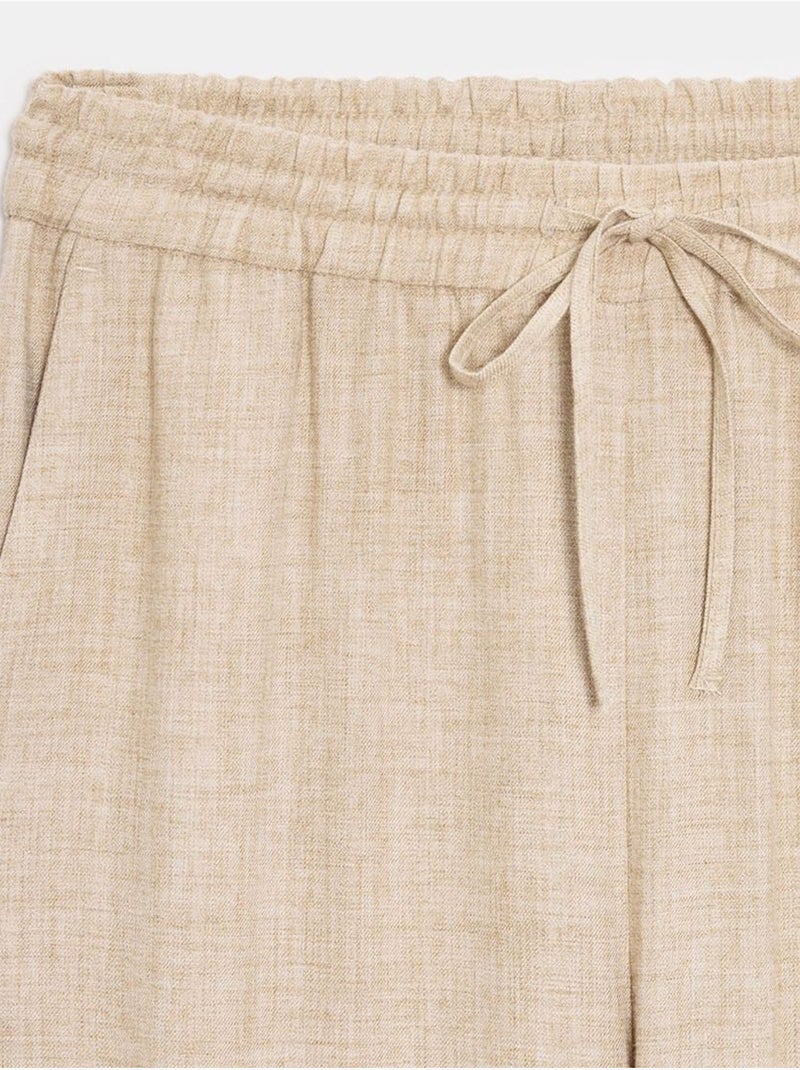 Pantaloni da donna in tessuto a gamba larga con vita con coulisse Beige - Kiabi